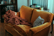 blanket and pillow on sofa