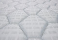 Close-up of a white quilted mattress pattern.